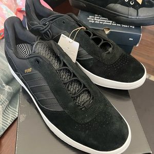 NWT - Adidas black Puig size 12 - never worn